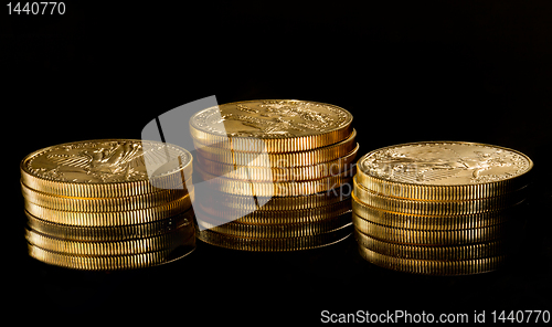 Image of Macro image of gold eagle coin on stack