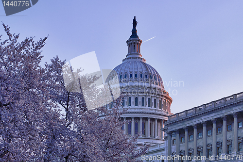 Image of Sunrise behind the dome of the Capitol in DC