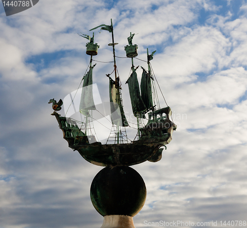 Image of Model of sailing ship against cloudy sky