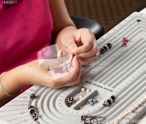 Image of Making bead necklace