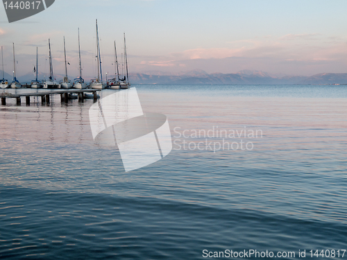 Image of Yachts at dock in sunset