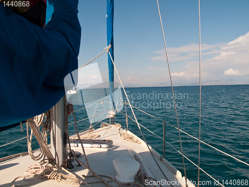 Image of White yacht sailing on calm sea