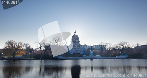 Image of Sunrise behind the dome of the Capitol in DC