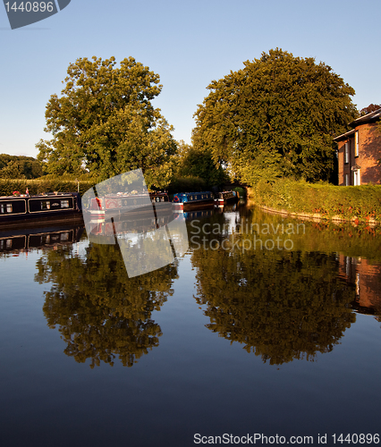 Image of Canal barges reflected in the water