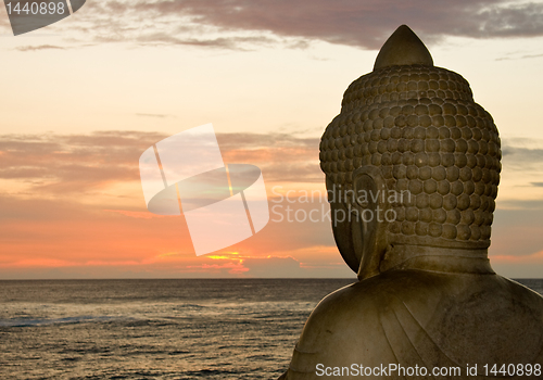 Image of Buddha and sunset