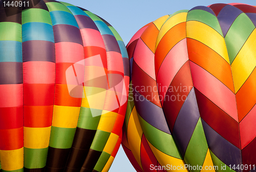 Image of Two Hot air balloons bumping