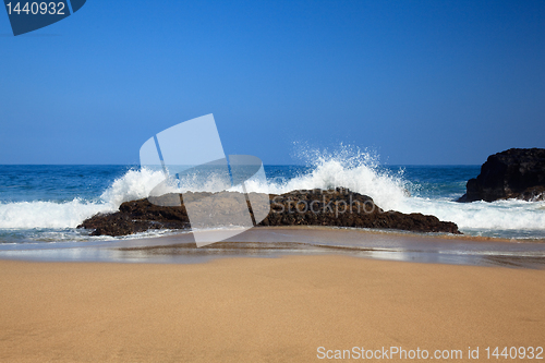 Image of Waves over rocks on Lumahai