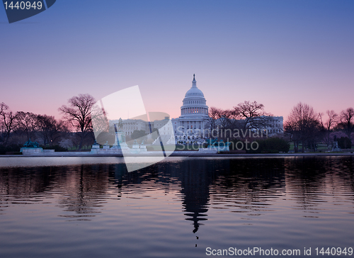 Image of Sunrise behind the dome of the Capitol in DC