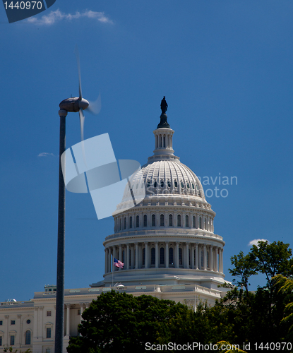 Image of Capitol Building framed by wind turbine