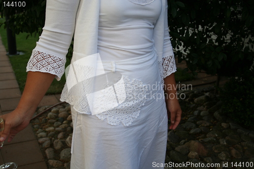 Image of White dress with lovely pattern of the skirt