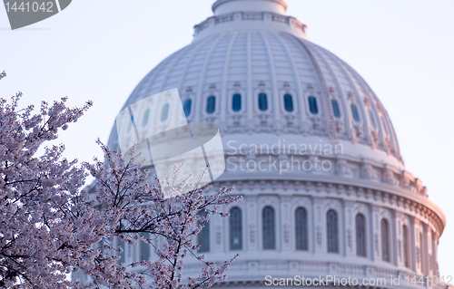 Image of Sunrise behind the dome of the Capitol in DC