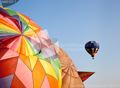 Image of Hot air balloon in the air above two others