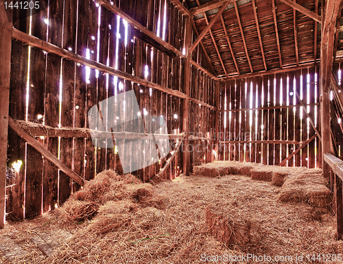 Image of Interior of old barn with straw bales