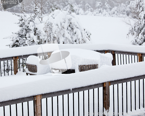 Image of Deep snow on deck with table