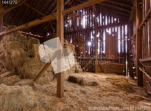 Image of Interior of old barn with straw bales