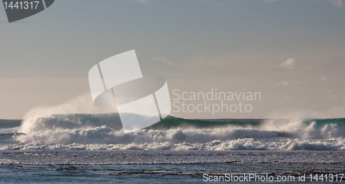 Image of Waves breaking on the reef off a sandy beach