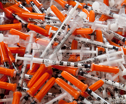 Image of Close-up of used hypodermic syringes