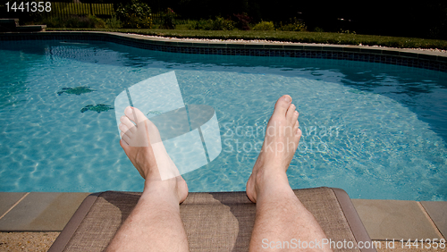 Image of Old feet overhanging pool