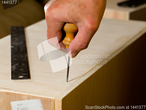 Image of Woodwork tools working on piece of plywood