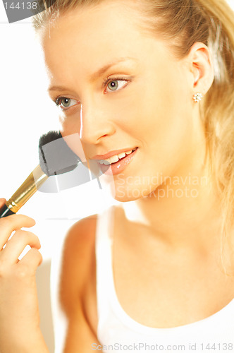 Image of Girl doing makeup