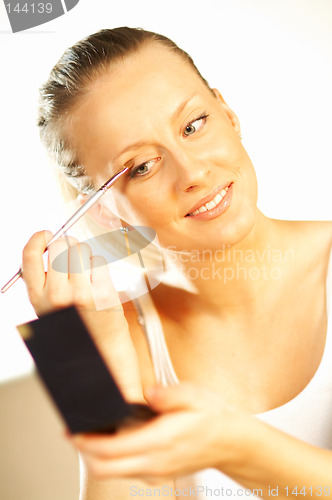 Image of Girl doing makeup