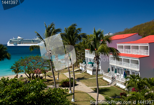 Image of Cruise ship sails by vacation resort