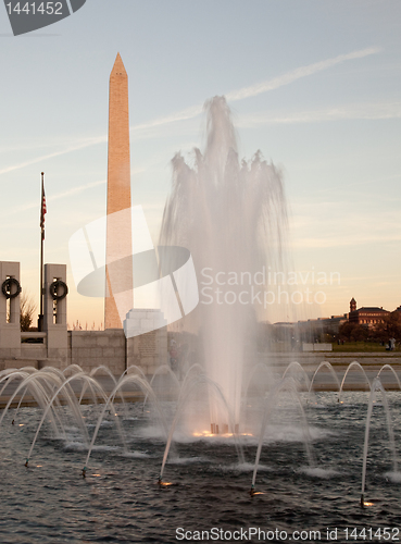 Image of Washington Monument behind fountain at sunset