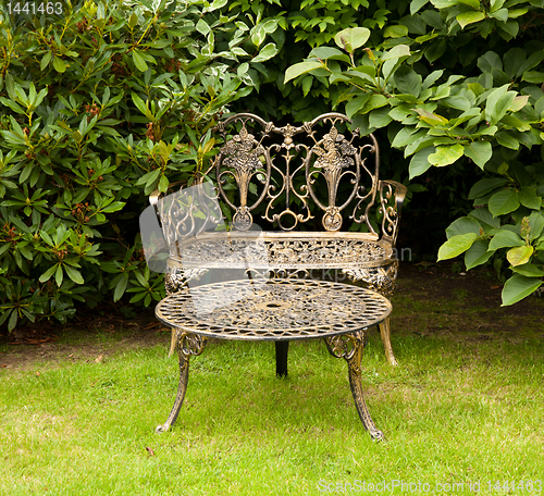 Image of Cast iron table and bench