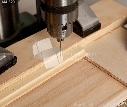 Image of Drilling small hole in wood