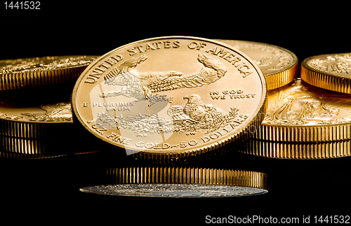 Image of Macro image of gold eagle coin on stack