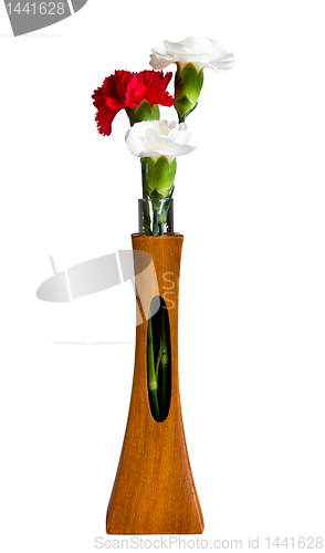 Image of Red and white spray carnations in teak vase