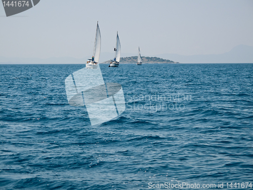 Image of Three yachts in ocean