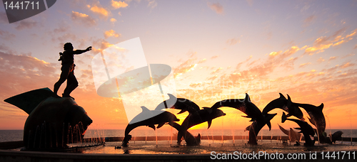 Image of Sunset with statue of Dolphins and Fisherman in Mazatlan