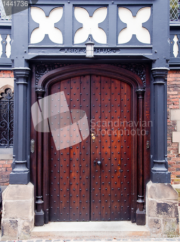 Image of Ornate dark wood entrance door