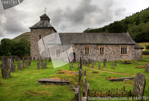 Image of Cloudy sky overshadows Melangell Church in Wales