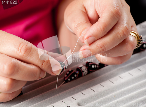 Image of Making bead necklace