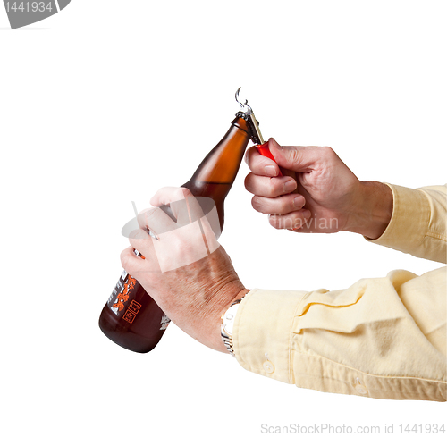 Image of Cap being removed from beer bottle
