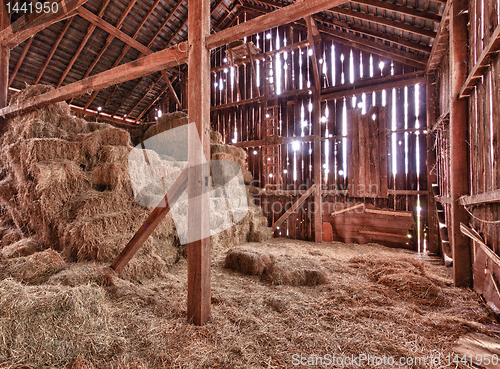Image of Interior of old barn with straw bales
