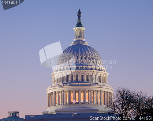 Image of Sunrise behind the dome of the Capitol in DC