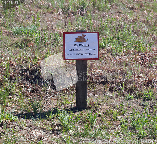 Image of Humorous drawing of rattlesnake on sign