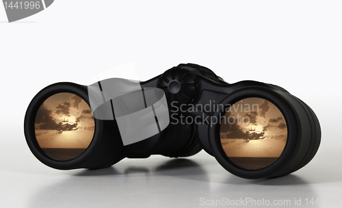 Image of Binoculars with rosy sunset view