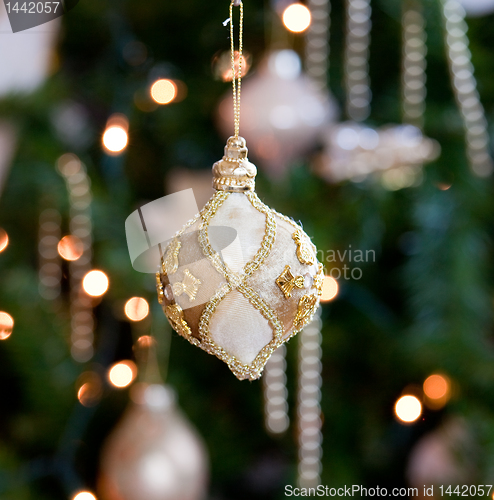 Image of Ornate decoration in front of Christmas tree