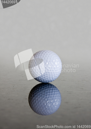 Image of Single golf ball reflection