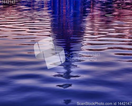 Image of Sunrise behind the dome of the Capitol reflected in water