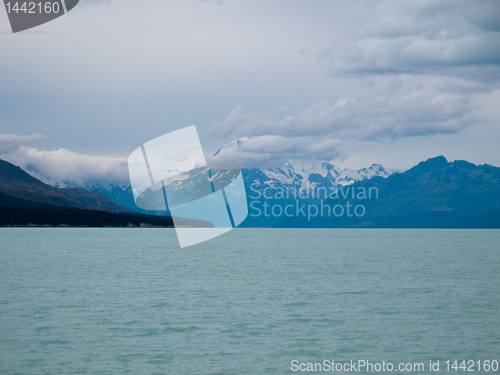 Image of Mount Cook over a blue lake Tekapo