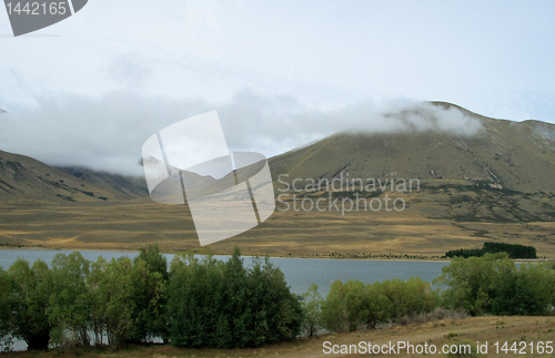 Image of New Zealand hills over a lake