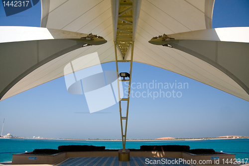 Image of Modern Abu Dhabi structure framing sea and island
