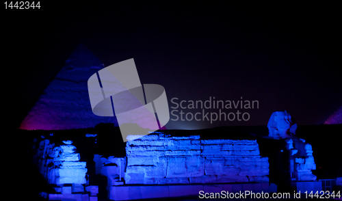 Image of Colored lights illuminate Sphinx and Pyramids