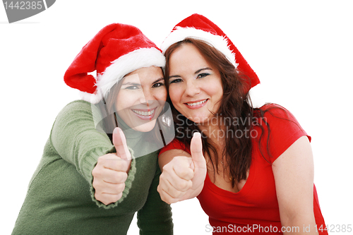 Image of happy young Christmas girls make a sign OK