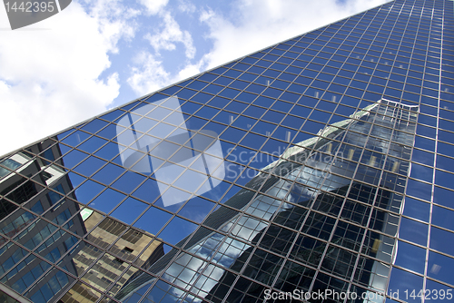 Image of Reflection of buildings on a glass building